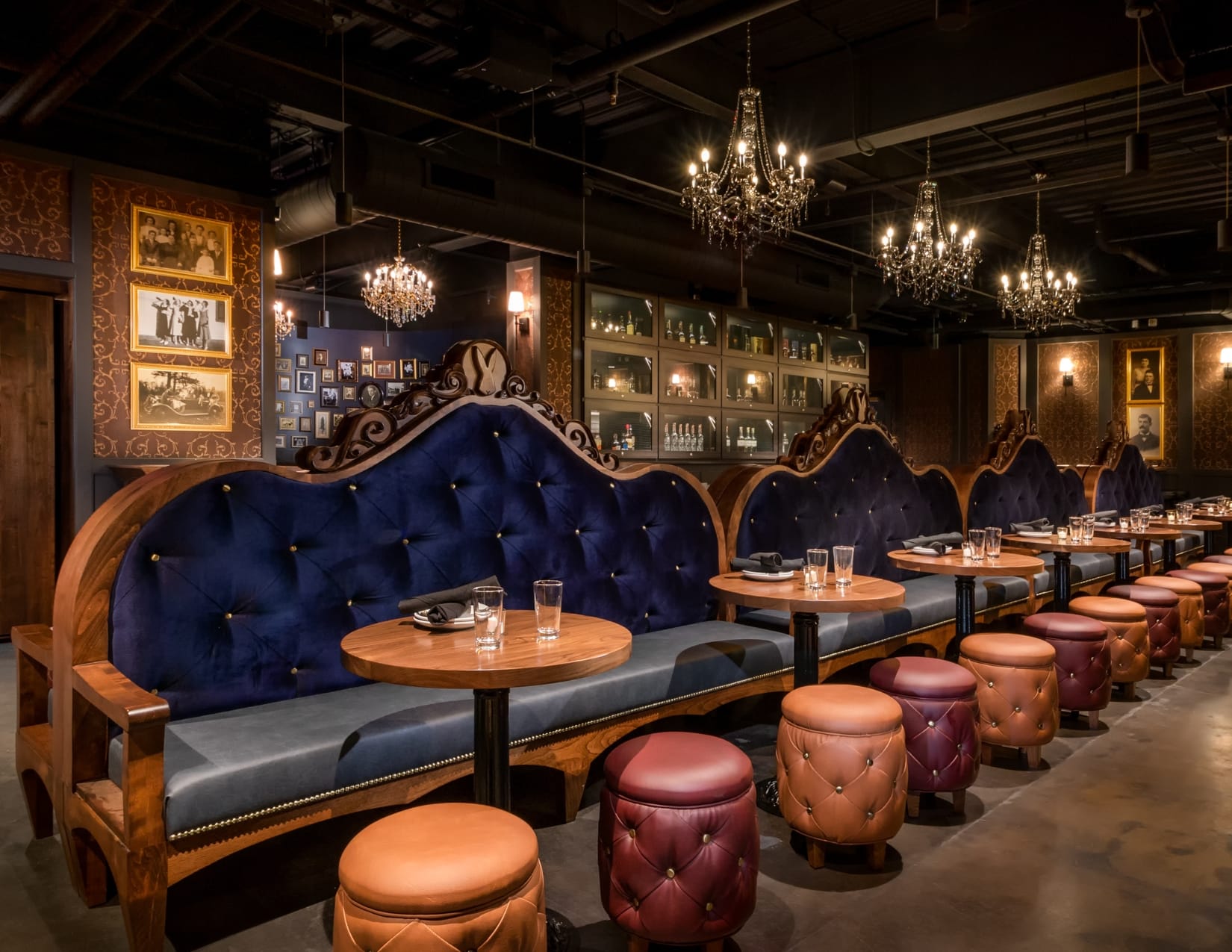 This hidden speakeasy features elegant chandeliers, purple velvet and leather booths and walls lined with vintage photos and medicinal bottles. 