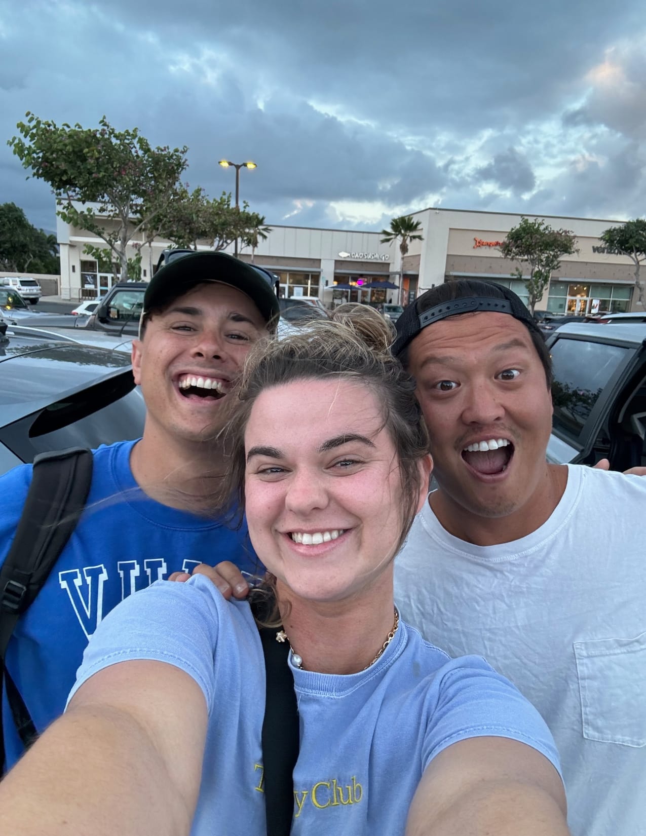 Three people posing for a selfie after taking a tour of the Road to Hana in Maui, Hawaii