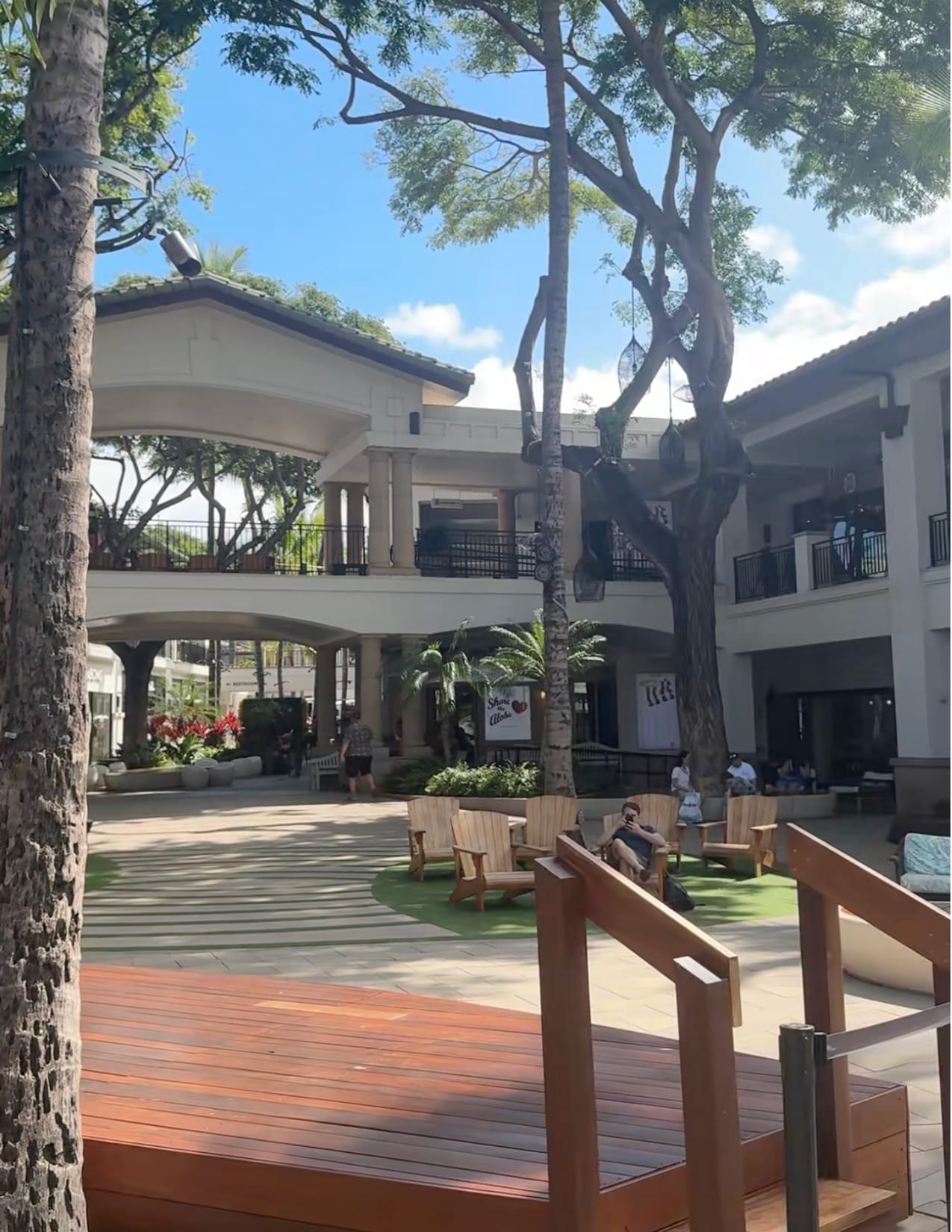 People sitting and lounging outside at The Shops at Wailea in Maui, Hawaii
