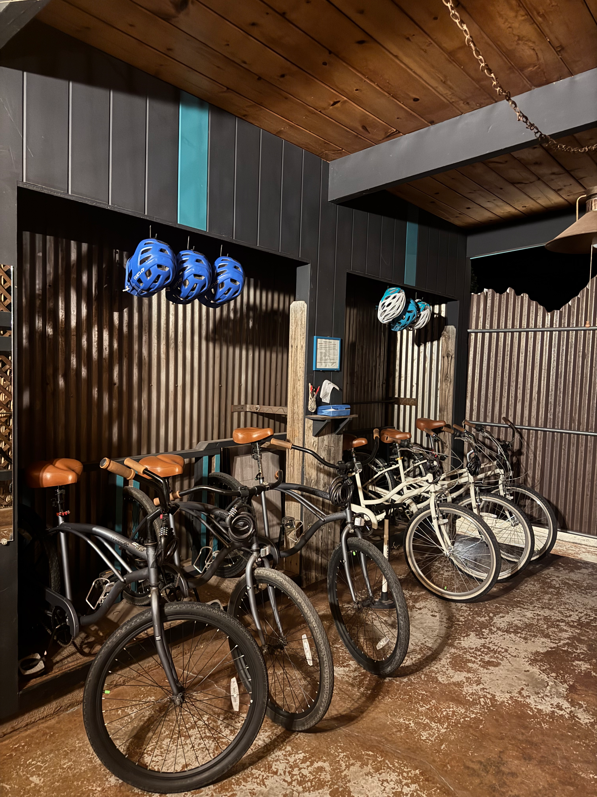 6 bikes lined up with blue and white helmets above them outside of the Westwater Room Airbnb in Moab, Utah