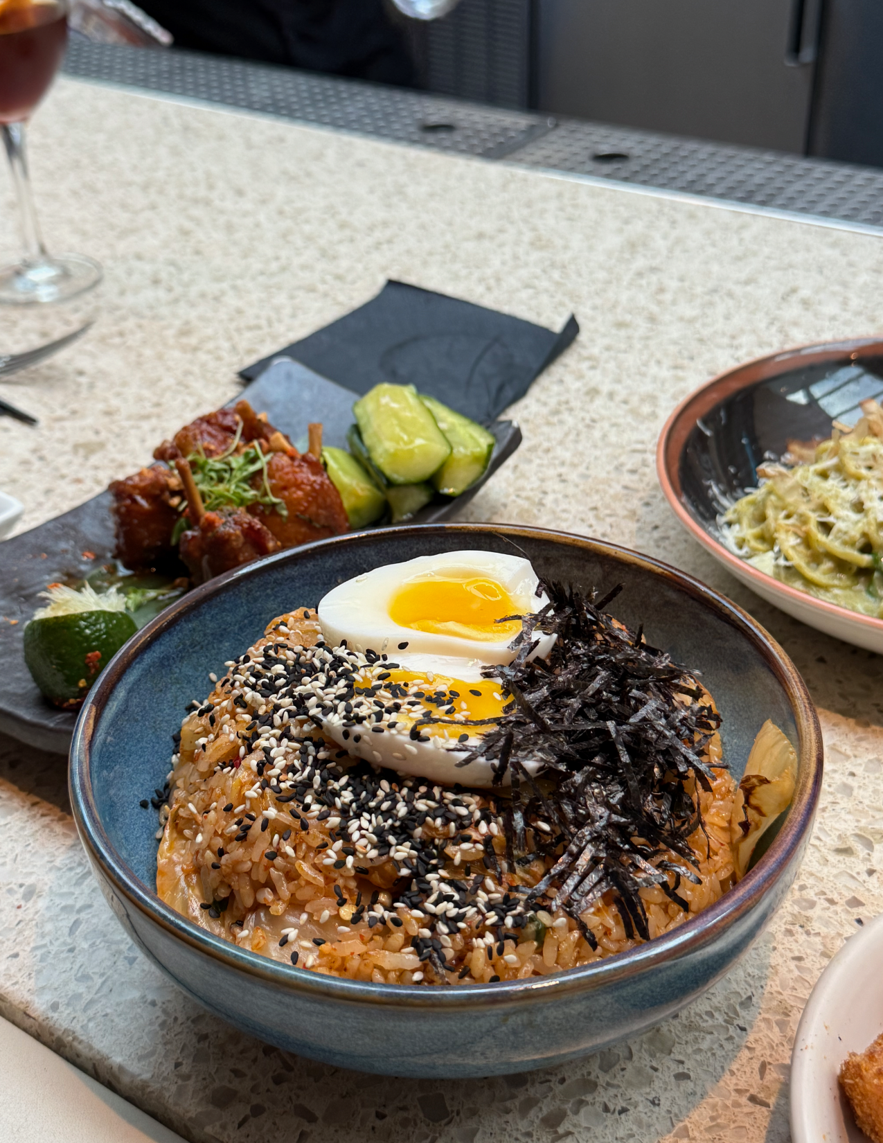Bowl of delicious Kimchi Fried Rice with an Egg at Departure in Portland, Oregon