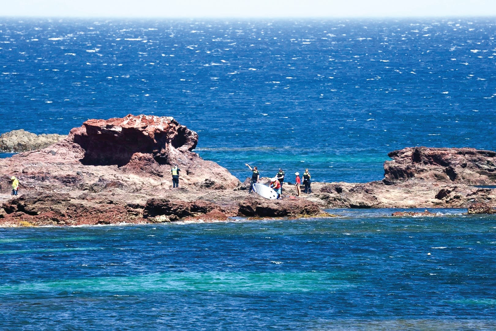Close calls as island swelters