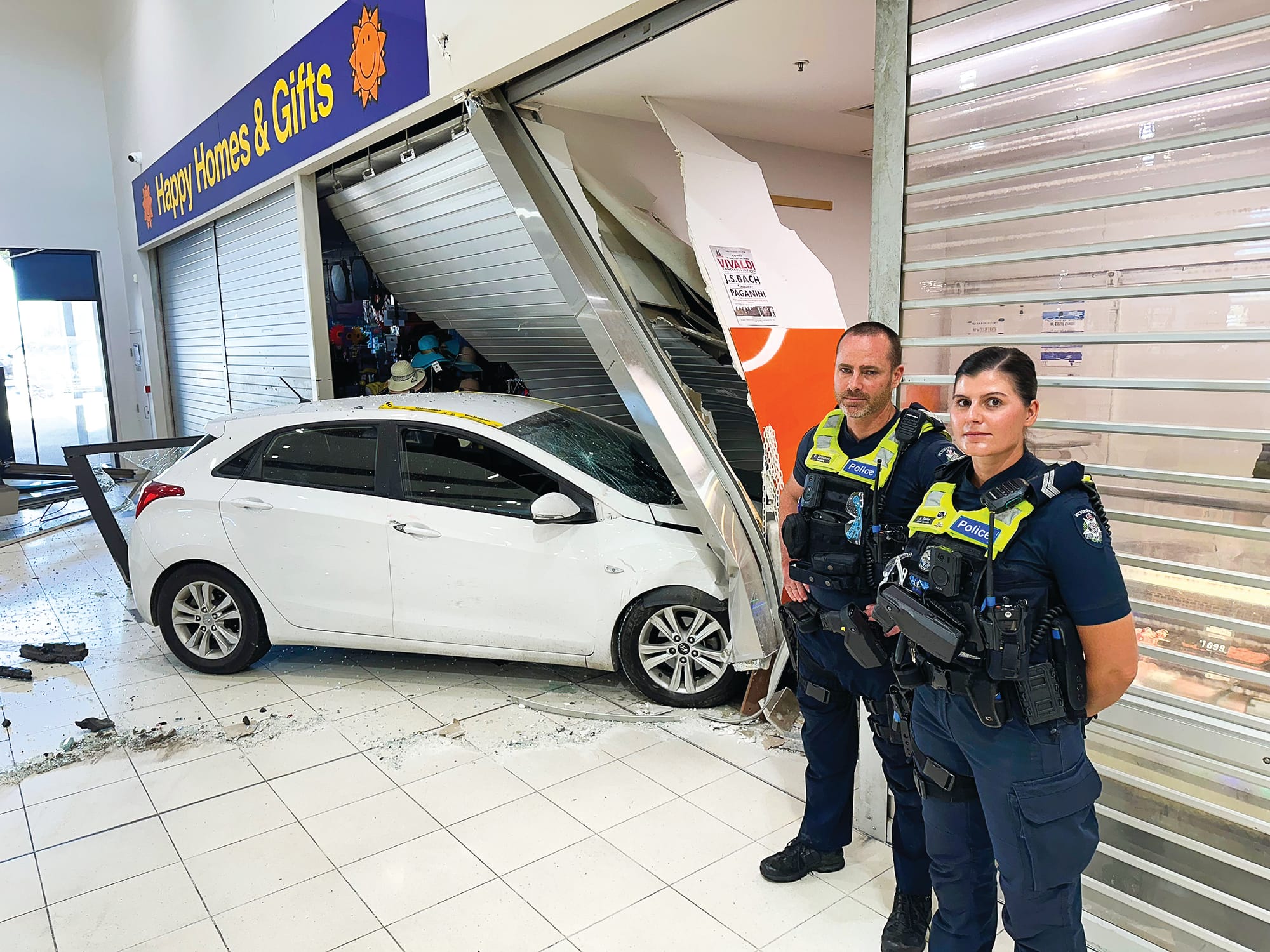 Car smashes Woolworth's Plaza, two shops