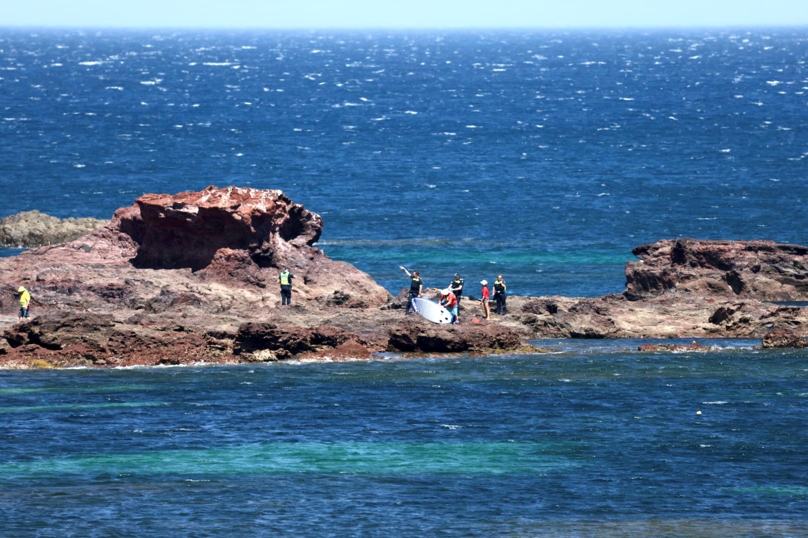 Two close calls as island swelters