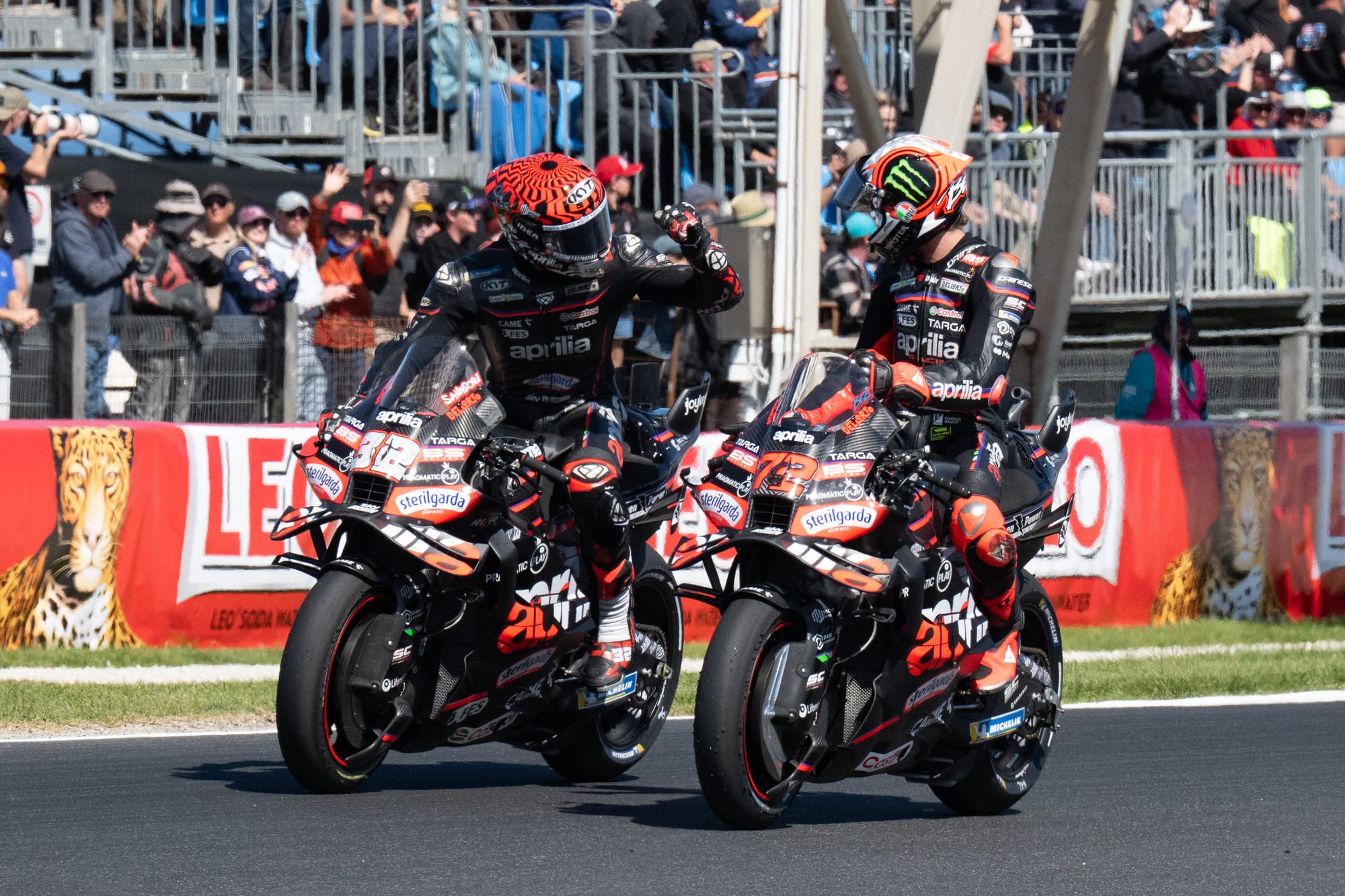Sprint Race winner Marco Bezzecchi gets a thumbs up from teammate Savadori. Bezzecchi also set a new lap speed record for Phillip Island.
