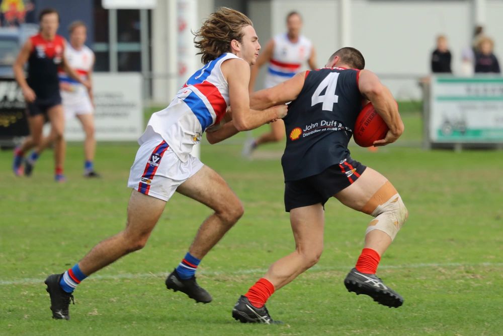 Bulldogs withstand Demons Heat post image