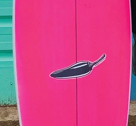Red handed thief makes off with hot pink board post image