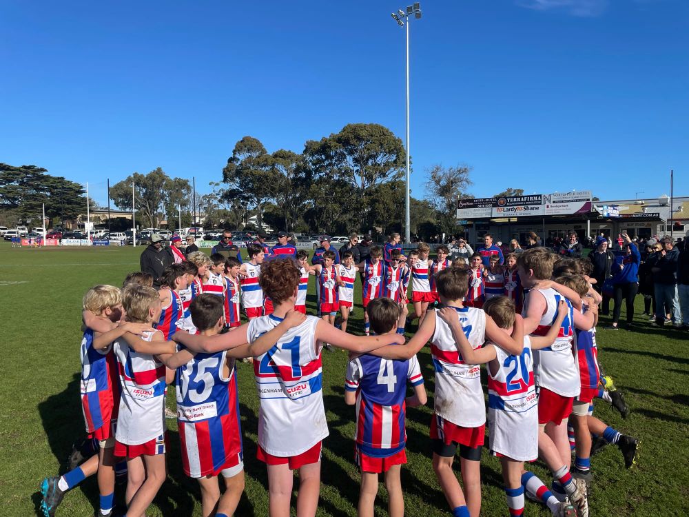 Who let the dogs out? Blues come out victorious against Reds in the Under 12 match! post image