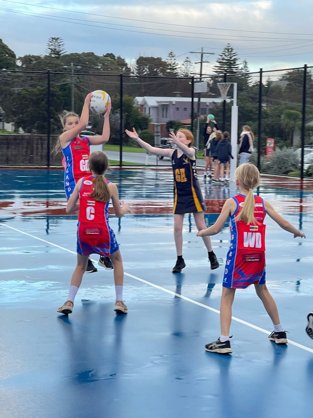 Netballers battle cold and wet conditions post image