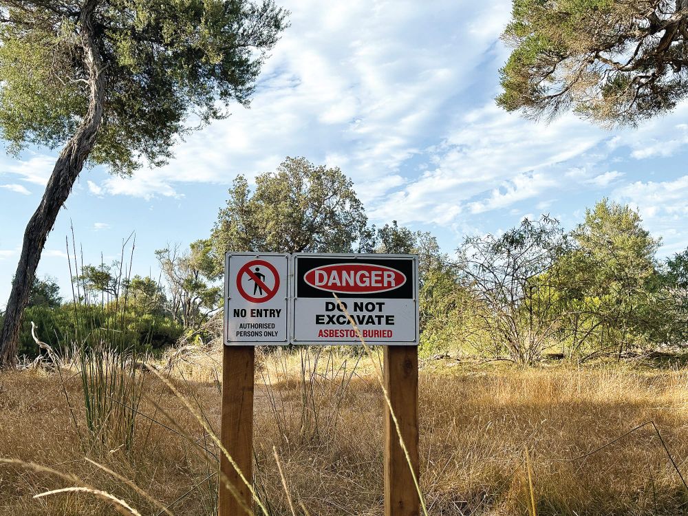 Keep clear of asbestos area post image