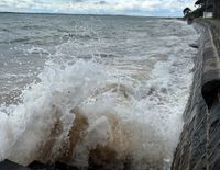 Tide, wind combine damaging post image