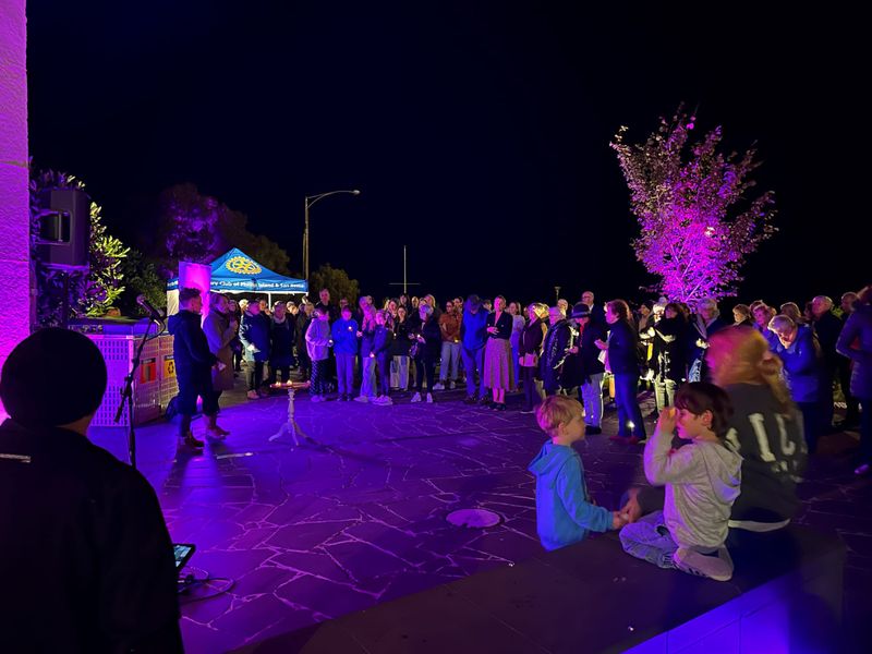 Candlelit Cowes lights up in fight against gendered violence post image