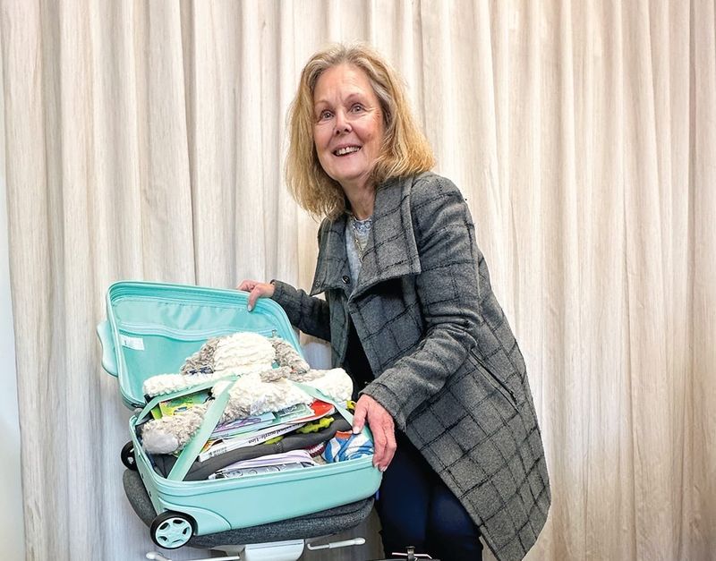 Suitcases overflowing with care post image