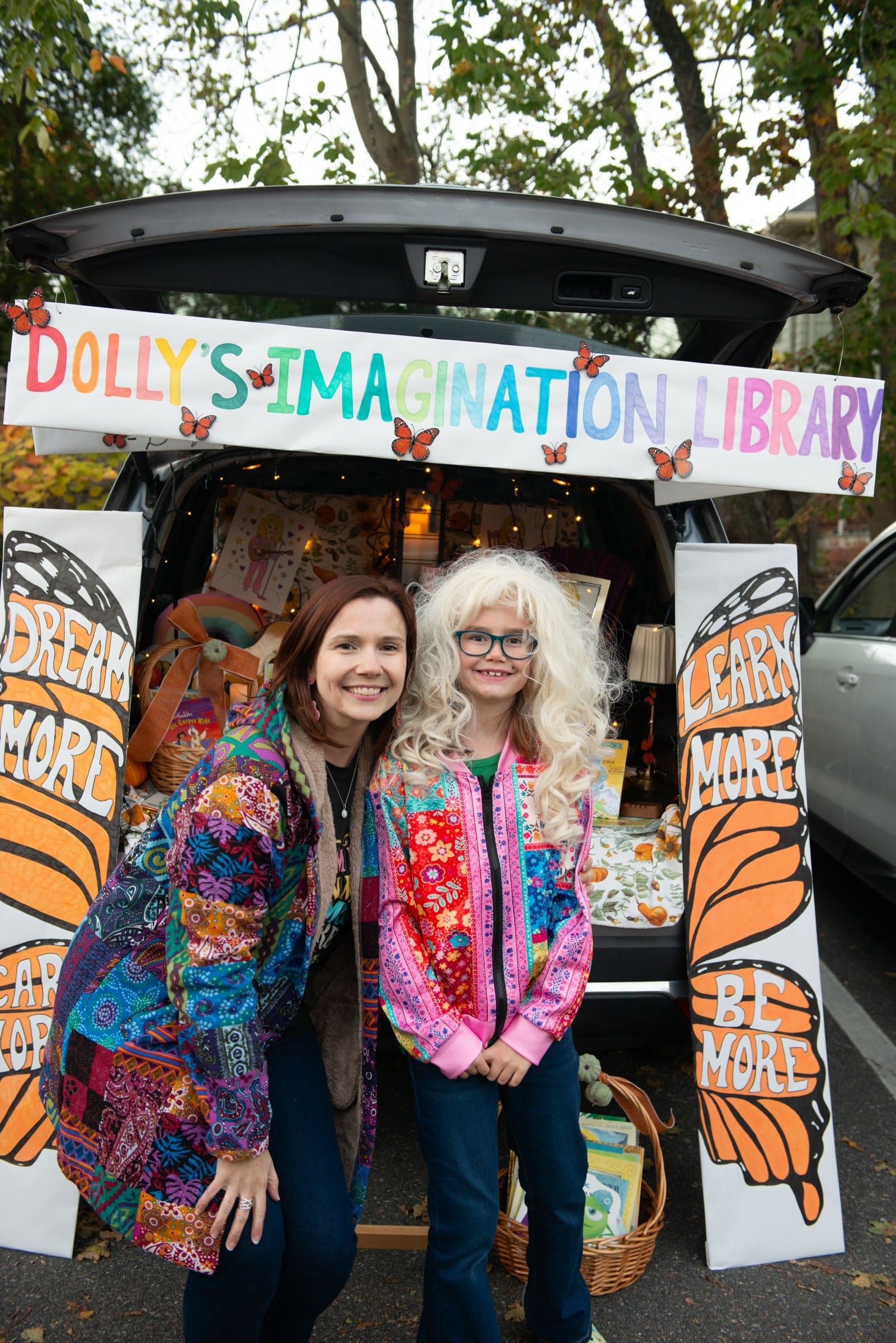 Jillian Peterson, left, and her daughter, Julia Peterson, pose in front of their Dolly’s Imagination Library trunk during Glover School’s Trunk or Treat on Oct. 23.