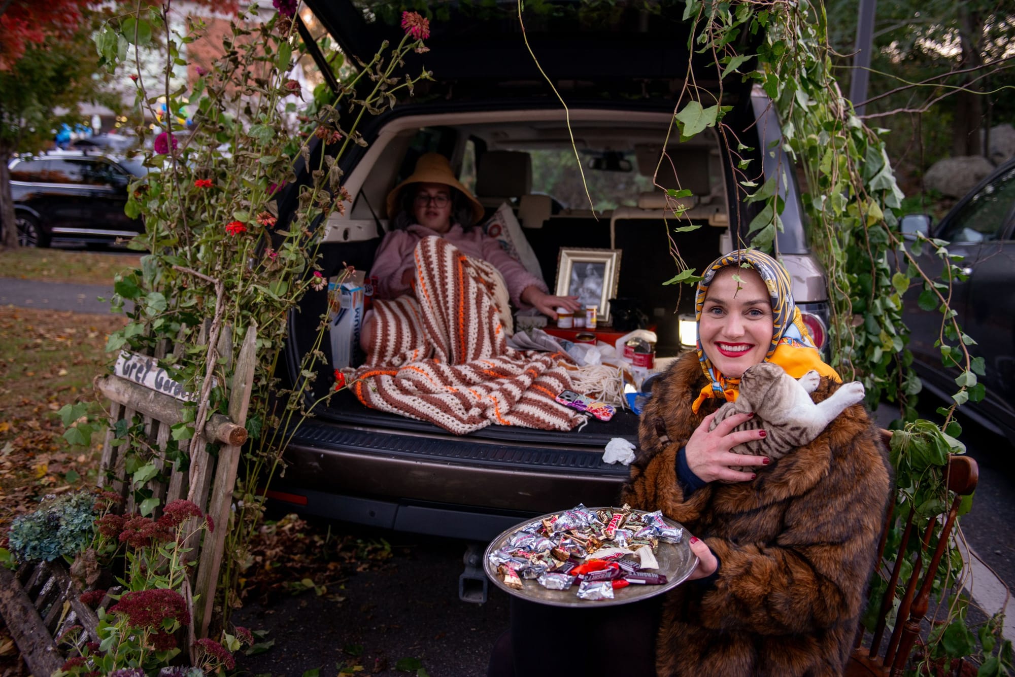 Nina and Wyley Dinsmore turn their trunk into a scene from “Grey Gardens,” complete with a stuffed cat and a tray of candy, at Glover School’s Trunk or Treat.