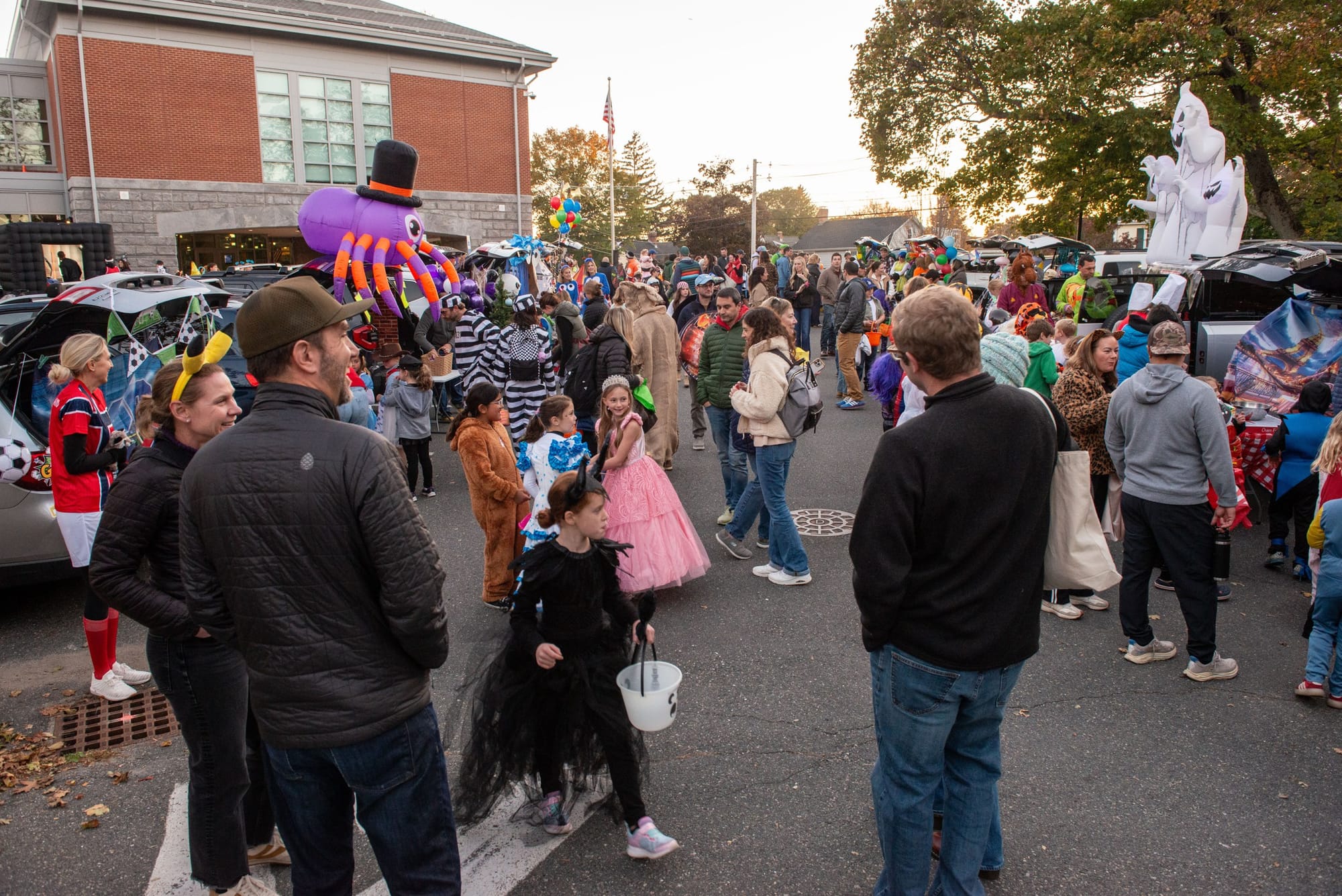 Families fill the Glover School parking lot as trick-or-treaters move from trunk to trunk during the school’s Trunk or Treat on Oct. 23.