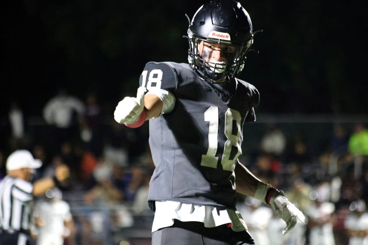 Owen Coyne, No. 18, points during Marblehead's season opener against Lynn English on Sept. 10