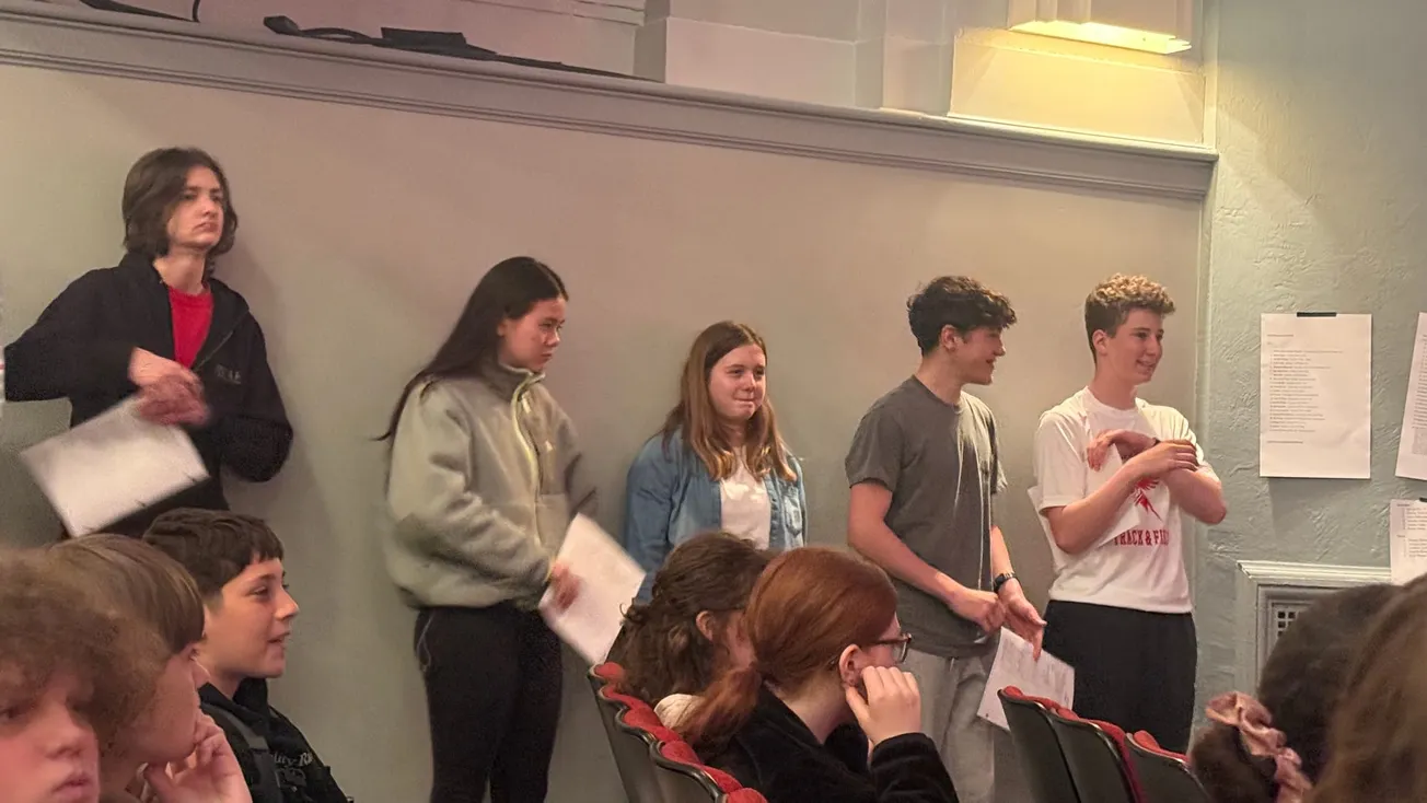 At Veterans Middle School, mock town meeting backs tier 2, rejects trash override