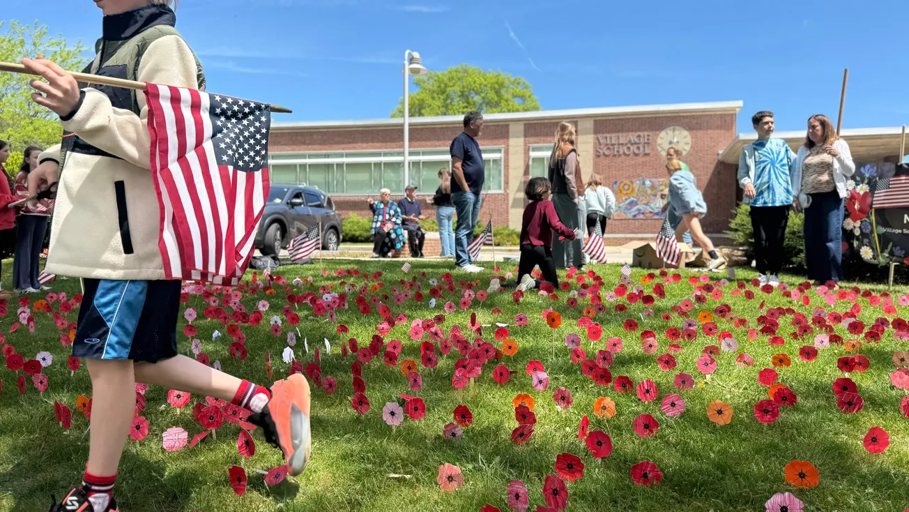 Village School children plant field of paper poppies to honor Marblehead's war dead