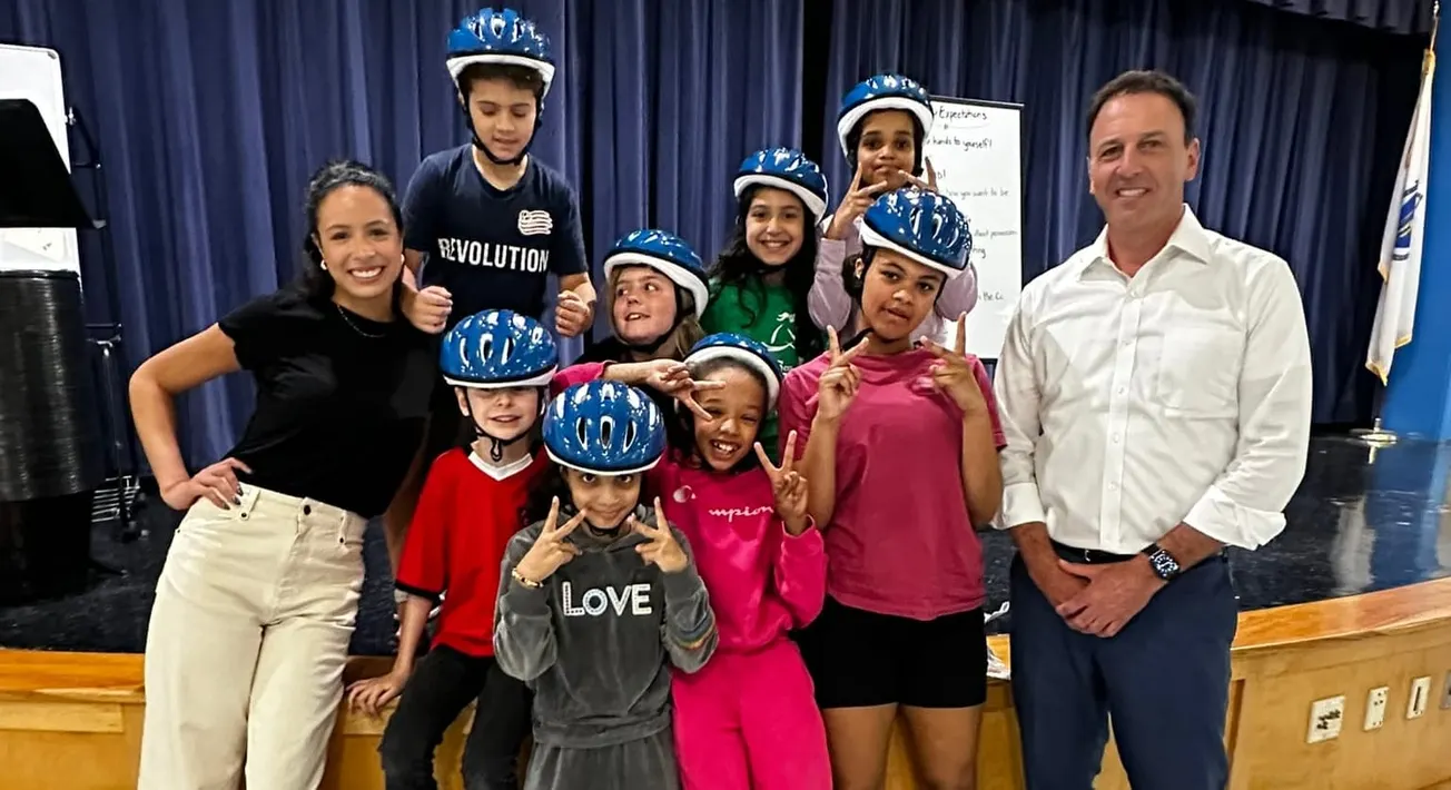 Marblehead attorney's firm donates bike helmets to 125 Salem students