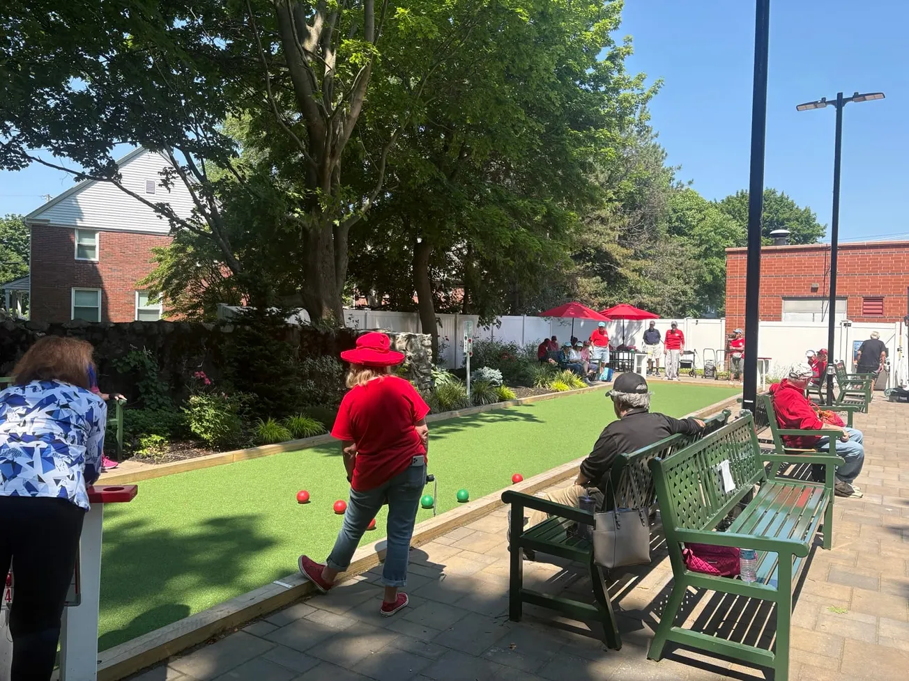 Bocce players honor Josie Crowley on the patio she loved