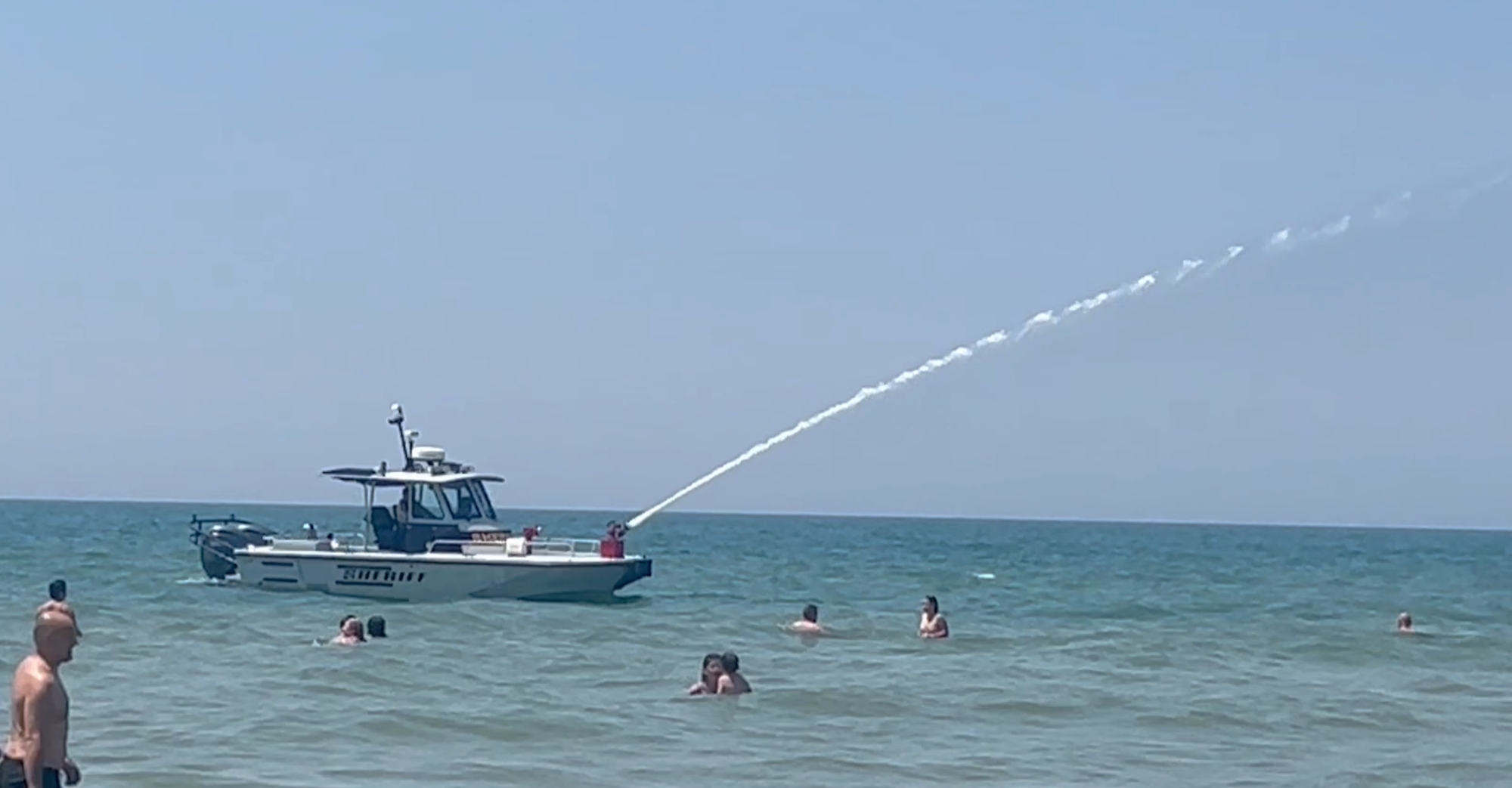 Beat the heat: Watch Ottawa County Sheriff’s Office Marine Unit cool down Grand Haven beachgoers