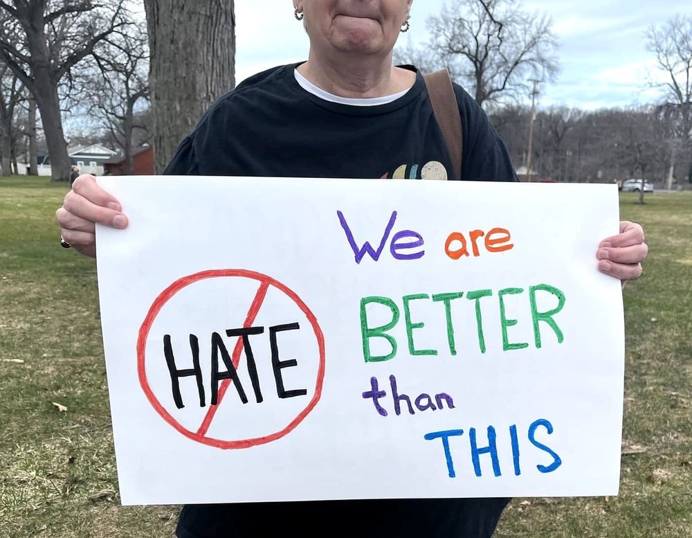 Holland residents host unity march to show solidarity against Trump Administration's actions post image