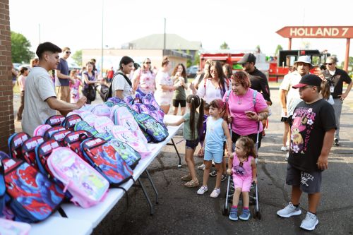LAUP back-to-school event draws 1,500 residents, hands out over 900 backpacks in Holland post image