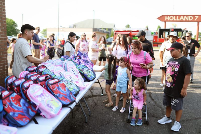 LAUP back-to-school event draws 1,500 residents, hands out over 900 backpacks in Holland post image