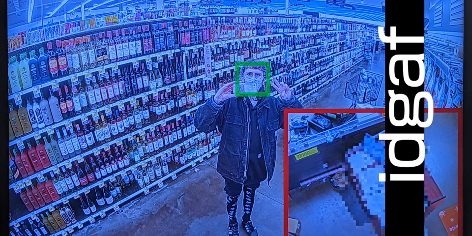 daphnis in an alcohol aisle through a surveillance camera photo. it says "idgaf" in weird ps2 font