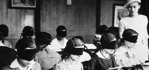 students blindfolded in classroom
