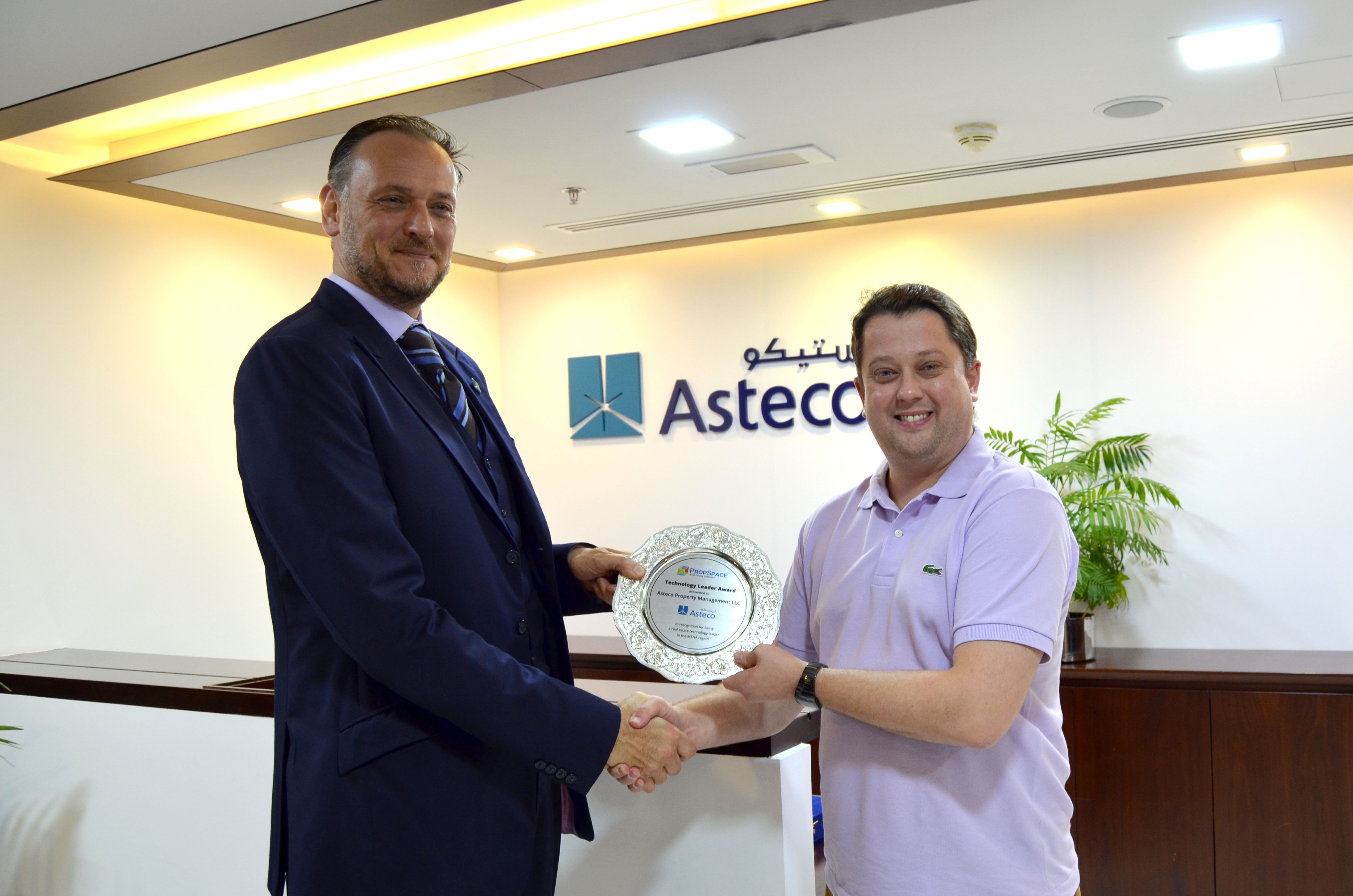 (From L-R) John Stevens, Managing Director of Asteco receives the award from Alex Nicholas, CEO and Co-Founder of PropSpace