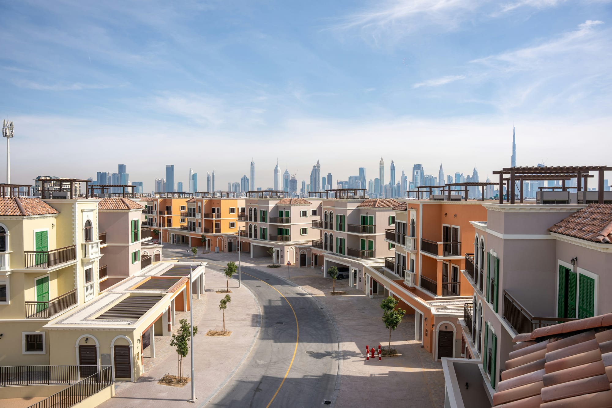 Street and buildings with Dubai skyline in the background