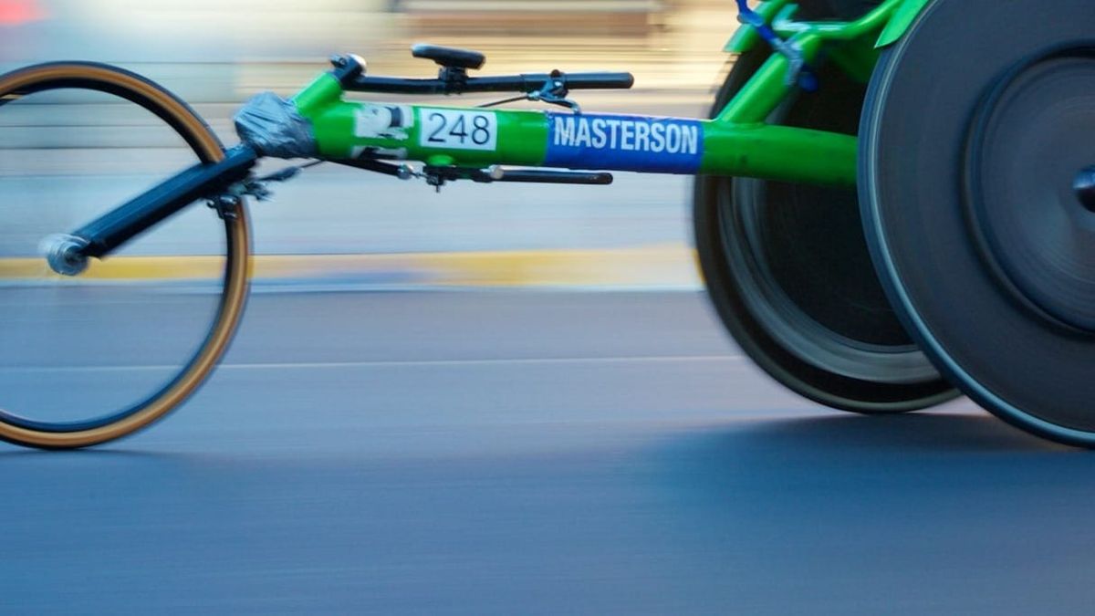 Cropped view of a green racing race with blurred background