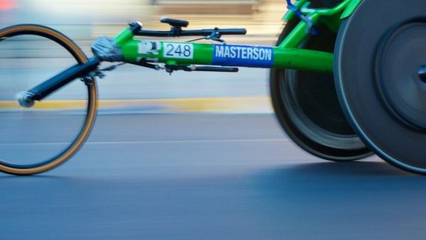 Cropped view of a green racing race with blurred background