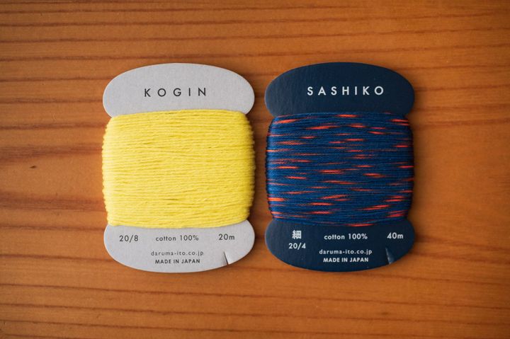 8 ply yellow kogin thread vs. 4 ply red and blue sashiko thread on cards by Daruma