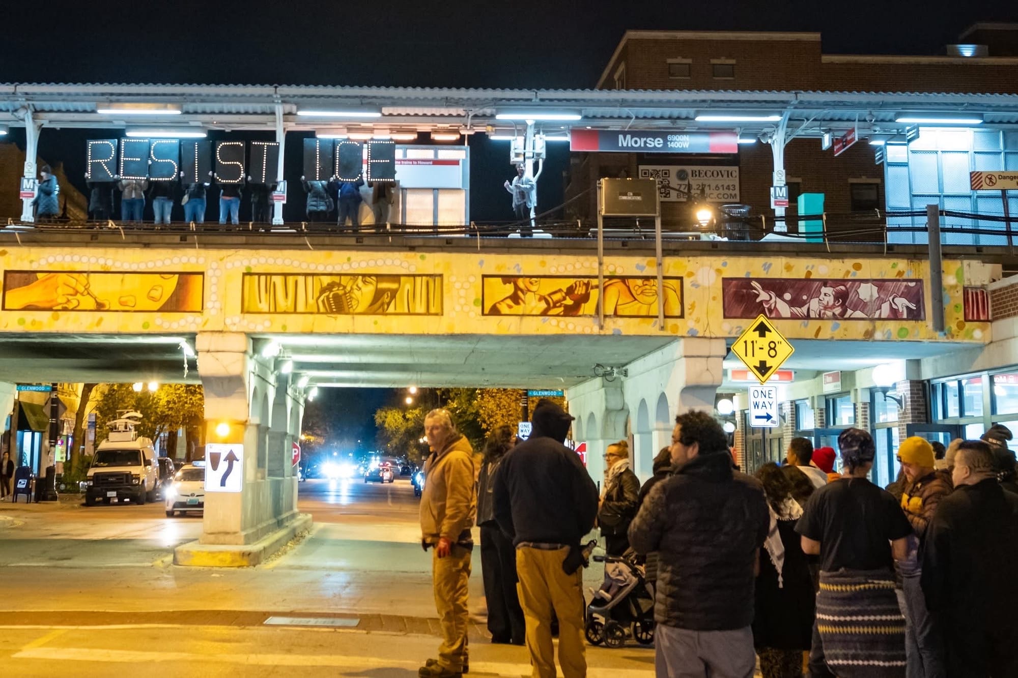 Photo: Sarah Ji - Rogers Park neighbors hold up large light boards spelling RESIST ICE on the CTA station platform at Morse and Glenwood. Photo: Sarah Ji - Rogers Park neighbors hold up large light boards spelling RESIST ICE on the CTA station platform at Morse and Glenwood.