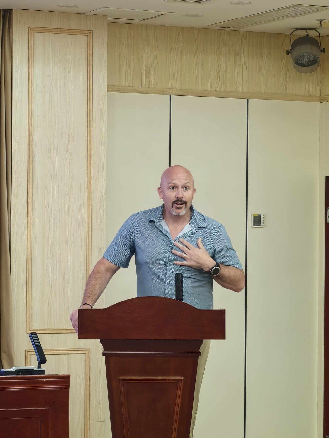 David speaking at a podium