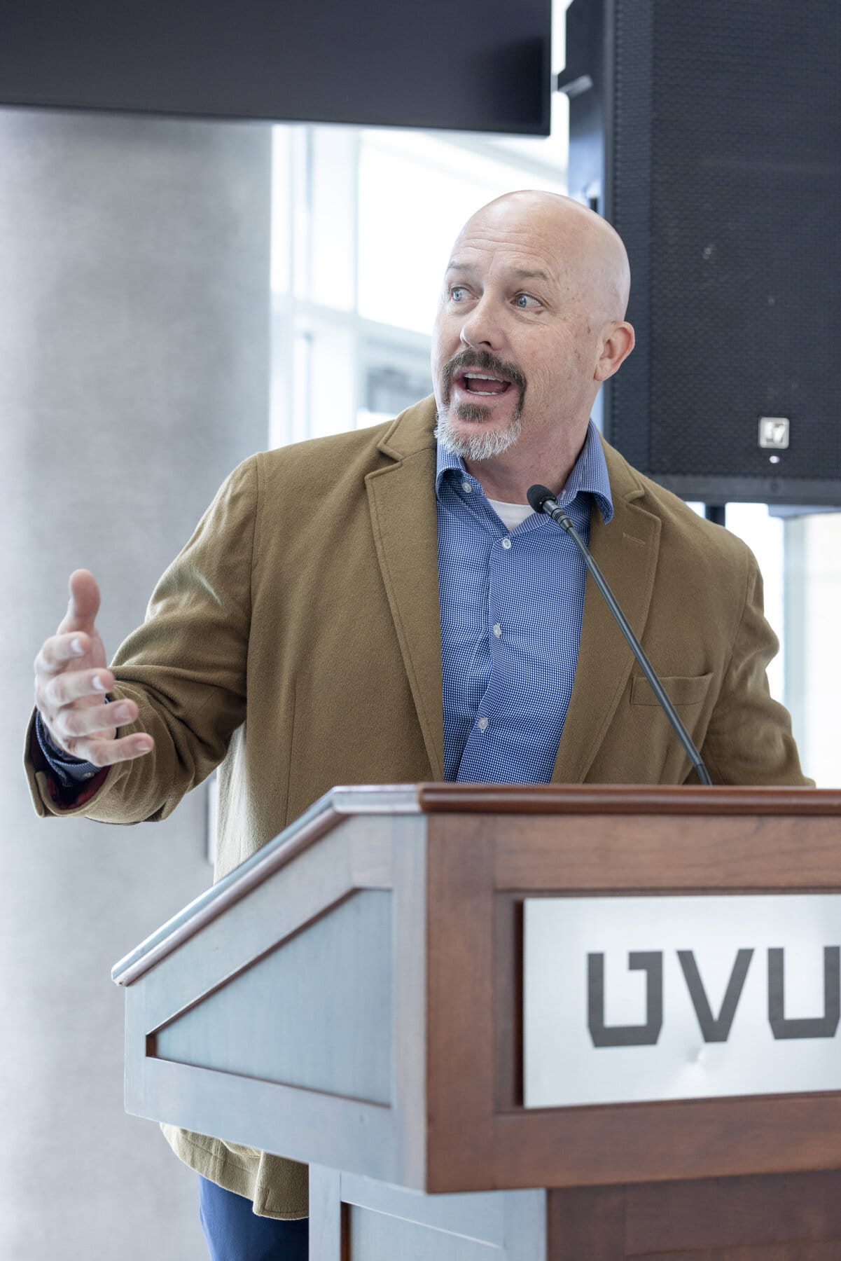 David Dayton speaking at a conference podium