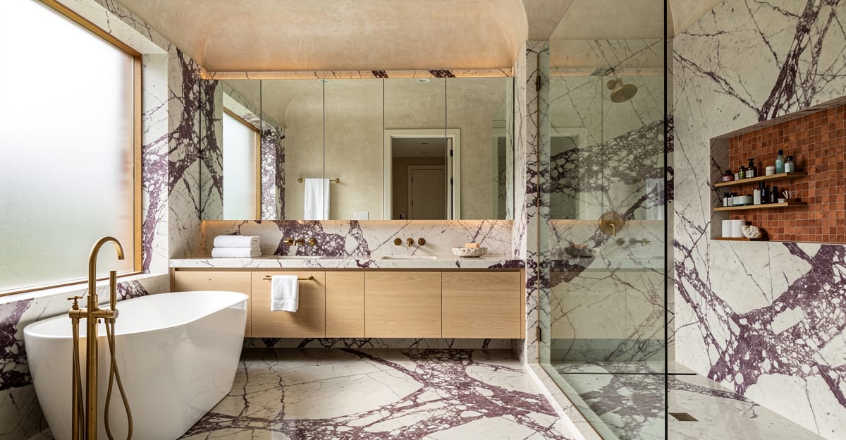 Luxury primary bathroom remodel in Los Gatos featuring Calacatta Viola marble, zellige tile accents, and unlacquered brass fixtures