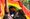 Two men stand face to face under a rainbow pride flag at a Pride Parade in Guwahati, Assam. One of them wears a plaid shirt w
