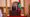 Mohamed Muizzu stands behind a wooden podium with the Maldives behind him on the right at his oath-taking ceremony as preside