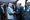 Muhammad Yunus (left) shakes hands with Shehbaz Sharif (right) amid a group of officials at a reception in New York in Septem