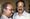 An old photograph of M T Vasudevan Nair (right), wearing glasses and a light striped shirt, smiling while facing the camera. 