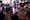 Ranil Wickremesinghe surrounded by police and lawyers coming out of the courtroom after being arrested for misusing state fun