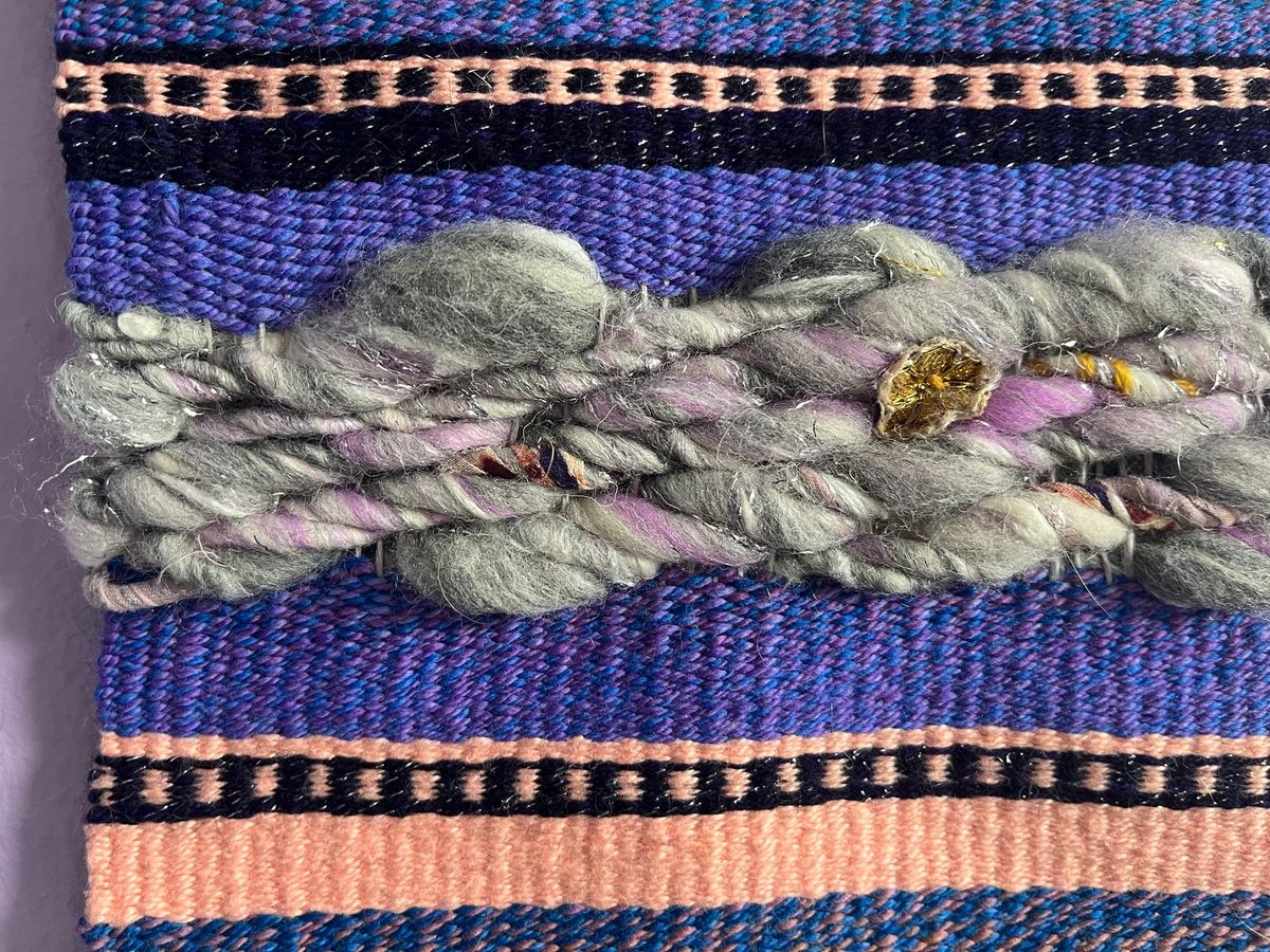 Purple tapestry with recycled art yarn