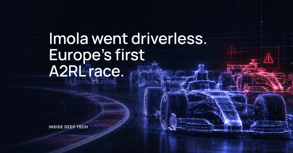 Wireframe outlines of formula cars on a track, drawn in blue and red light