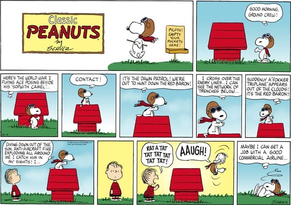 Color Peanuts Sunday comic featuring Snoopy flying his doghouse against the Red Baron with the text “It’s the Red Baron.” 