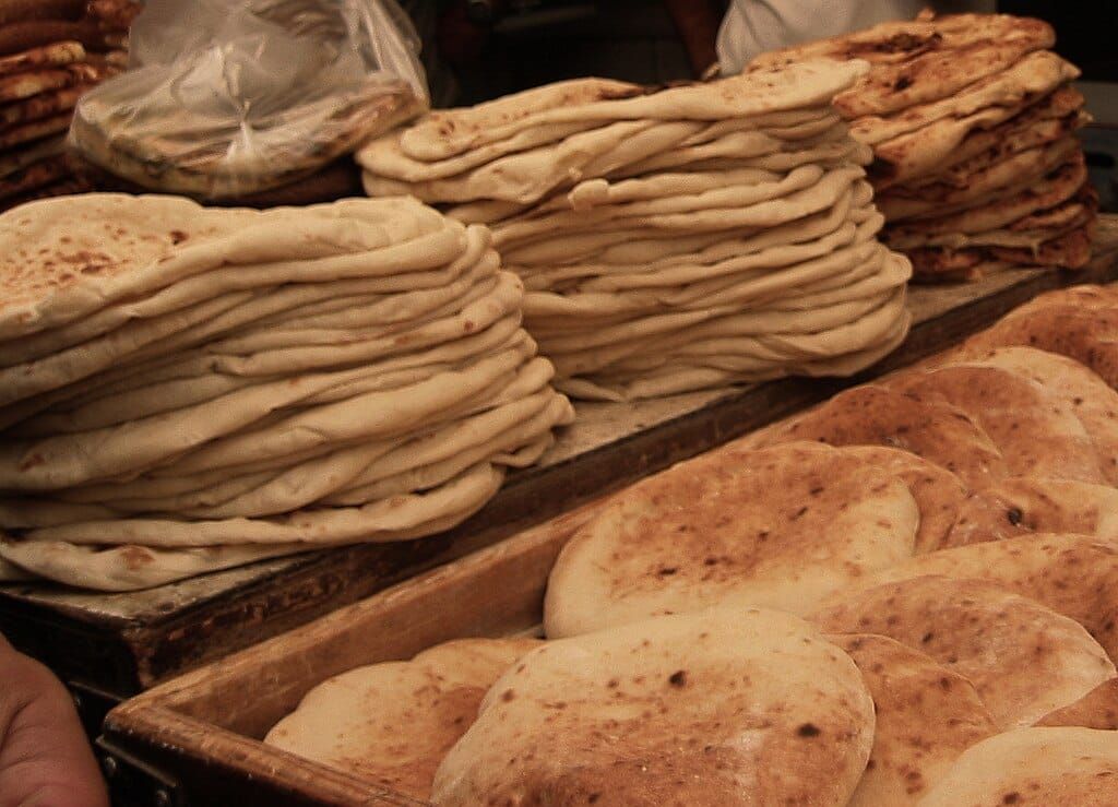 Photo of stacks of pita for sale at a Jerusalem market, 2010