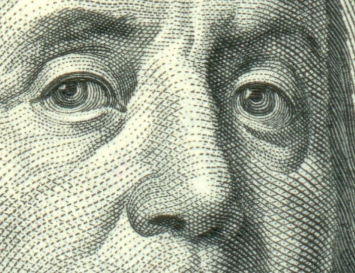 Closeup of Benjamin Franklin’s nose on a US$100 bill